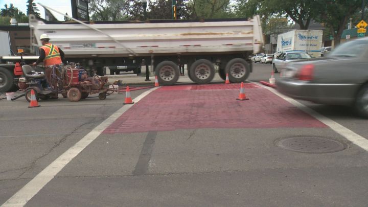 A crosswalk has been painted pink at 107 Avenue and 124 Street in Edmonton in order to make it safer for pedestrians.