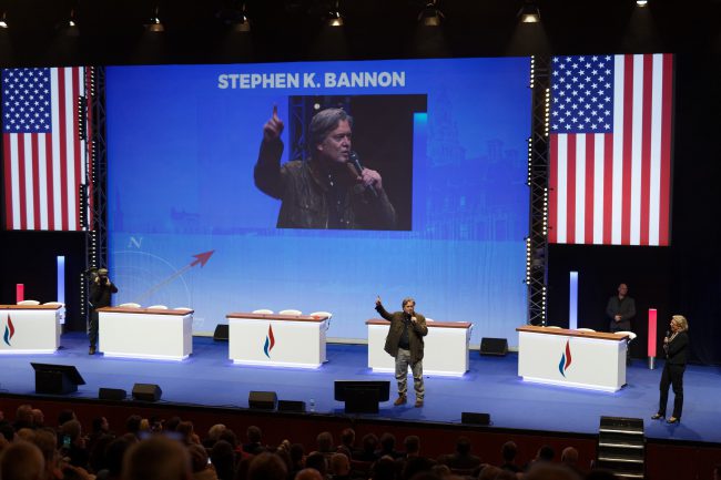 Steve Bannon addresses the French far-right Front National party's annual congress in Lille as party leader Marine Le Pen looks on, March 10, 2018.

