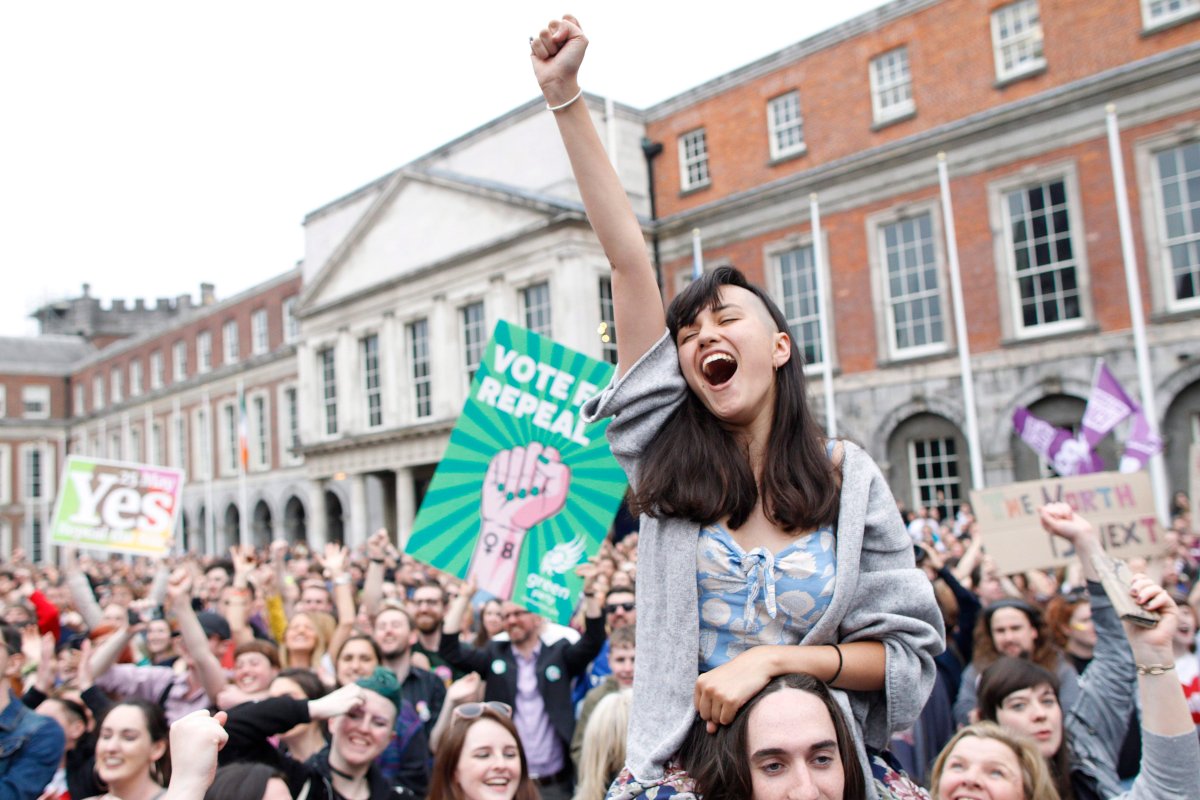 A woman from the"Yes" campaign reacts after the final result was announced in the Irish referendum on the 8th Amendment of the Irish Constitution at Dublin Castle, in Dublin, Ireland, Saturday May 26, 2018. 