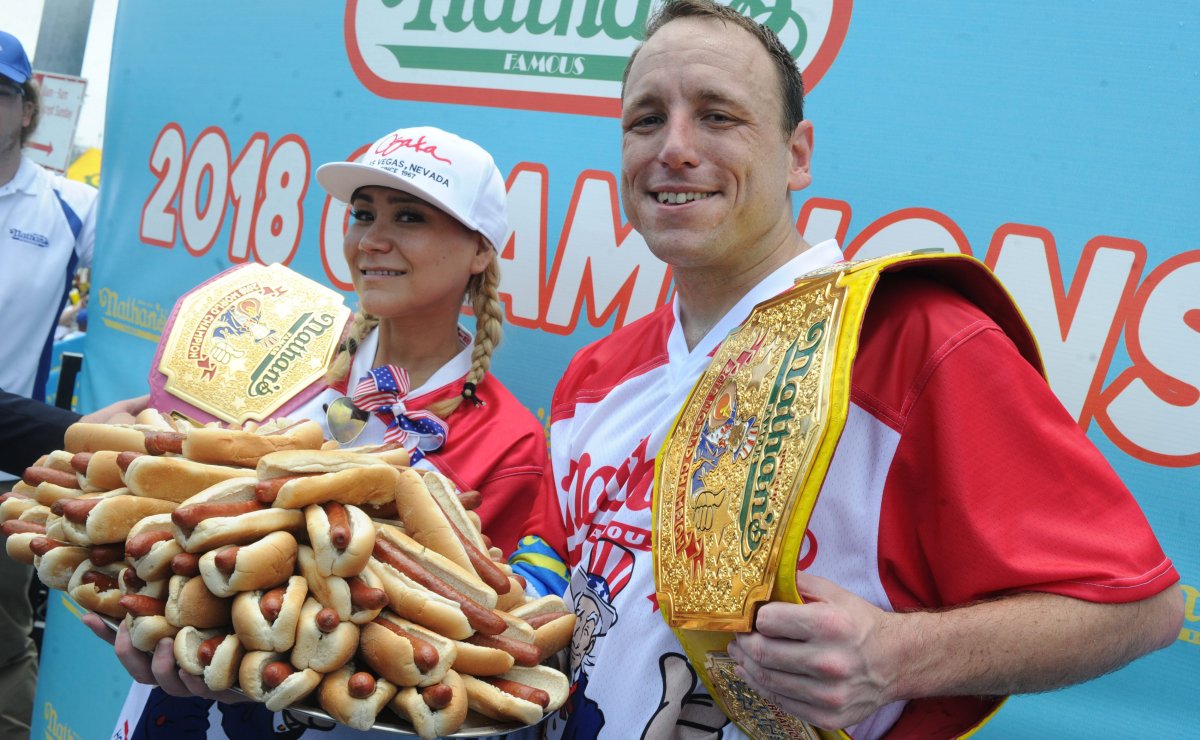 Joey Chestnut holds his championship belt and smiles after winning men's competition of the Nathan's Hot Dog Eating Contest at Coney Island of New York City, NY, USA, on July 4, 2018. 