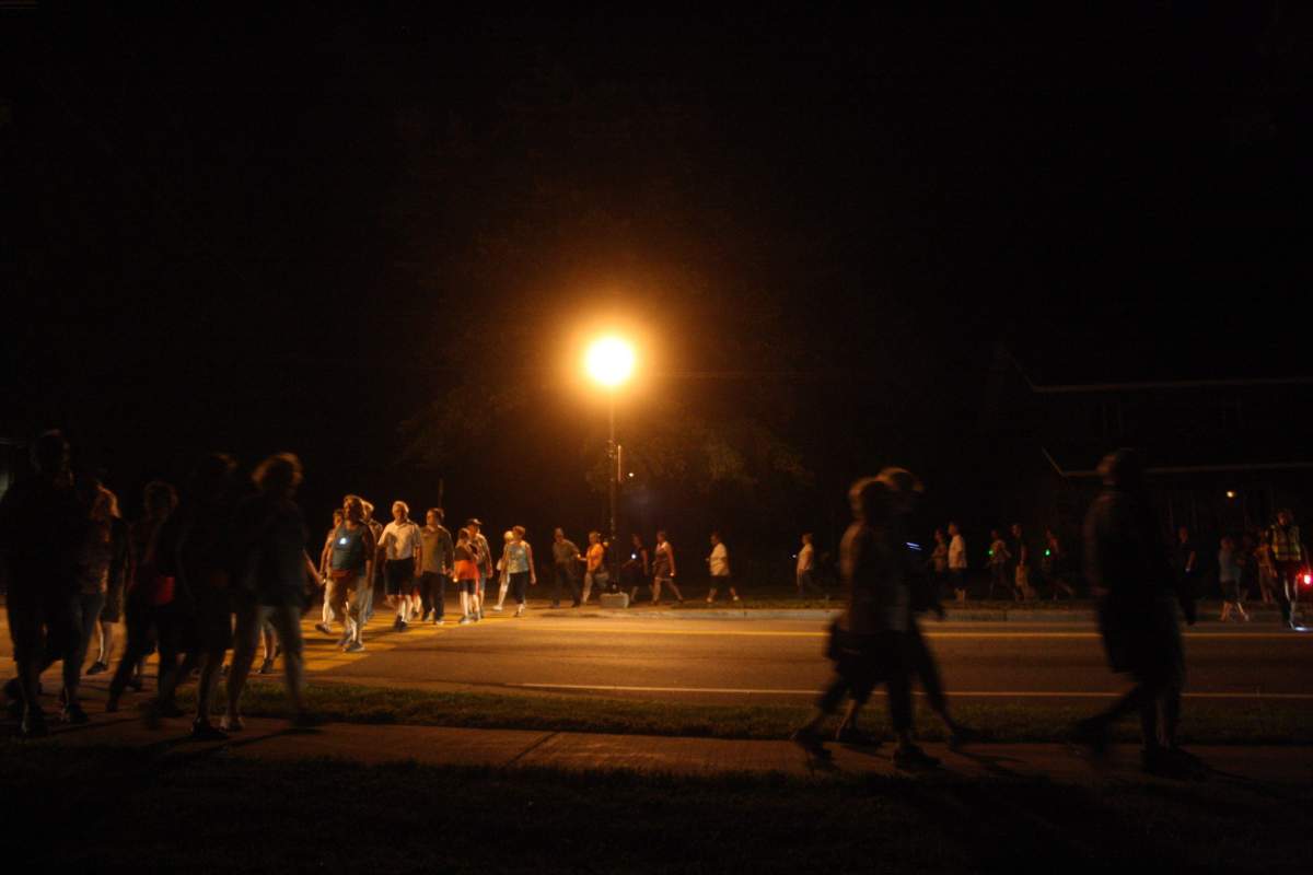About 200 people walked in silence between the church and the cemetery in Lac-Mégantic.