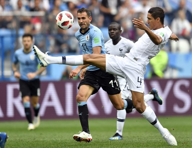 France’s Raphael Varane, right, is challenged by Uruguay’s Cristhian Stuani during the quarterfinal match between Uruguay and France at the 2018 World Cup in the Nizhny Novgorod Stadium, Nizhny Novgorod, Russia, July 6, 2018.