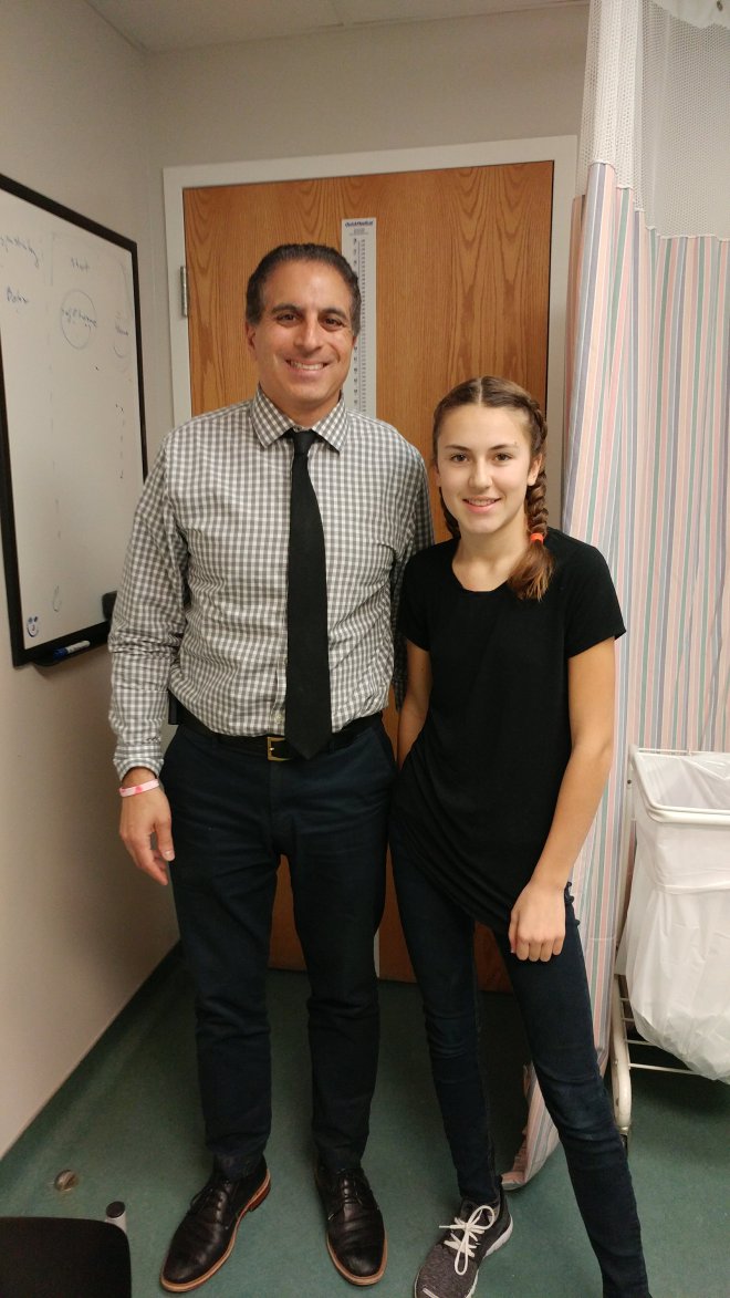 Dr. Ron El-Hawary and Jessica Robb pose for a photo after her surgery