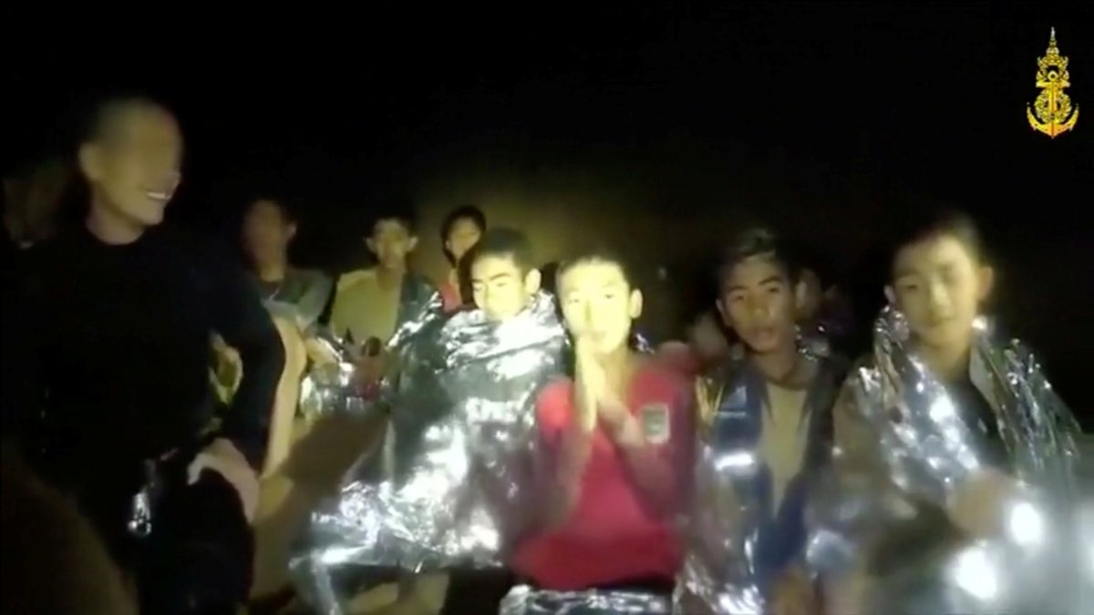 Boys from the under-16 soccer team trapped inside Tham Luang cave greet members of the Thai rescue team in Chiang Rai, Thailand, in this still image taken from a July 3, 2018 video by Thai Navy Seal.