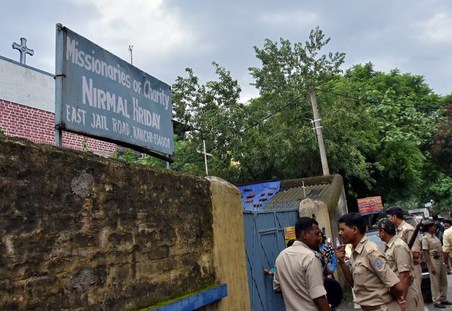 Police stand outside a home which provides shelter for pregnant unmarried women run by the Missionaries of Charity, Ranchi, India, July 4, 2018.