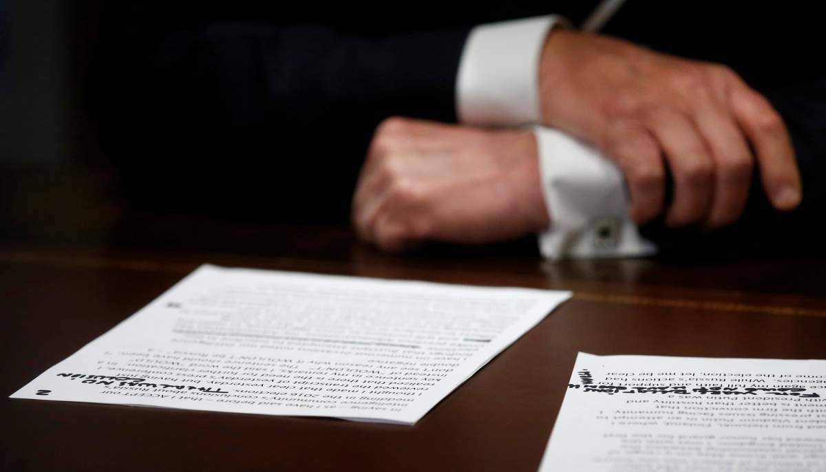 U.S. President Donald Trump’s prepared remarks show his own handwritten note “There was no collusion” at the top as he speaks about his summit meeting with Russian President Vladimir Putin at the start of a meeting with members of the U.S. Congress at the White House in Washington, July 17, 2018. REUTERS/Leah Millis