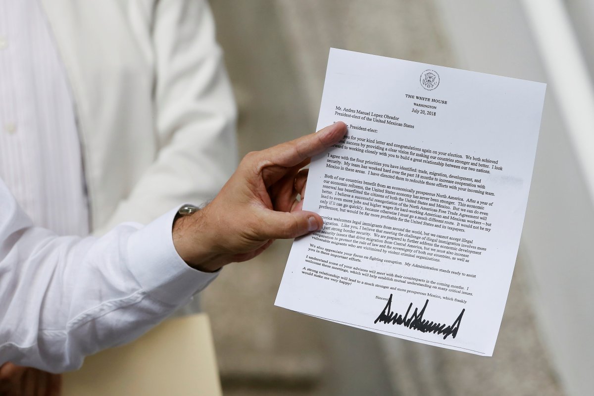 Marcelo Ebrard, picked by Mexico's president-elect Andres Manuel Lopez Obrador as foreign minister, shows the letter sent by U.S. President Donald Trump during a news conference at his campaign headquarters in Mexico City, Mexico July 24, 2018. 