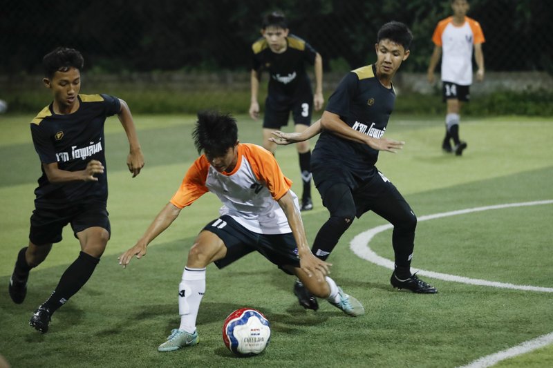 ×
None
In this July 15, 2018, photo, Wild Boars football team, in black, play a local team during a Mae Sai football league soccer match in Mae Sai district in Chiang Rai province, northern Thailand. At least 3 of the 12 boys and coach of another local team who were rescued from a cave in northern Thailand last week are stateless, living in a limbo that puts serious restrictions not only on their upward mobility, but even on their right to travel outside of Chiang Rai, the northern province where they live. 