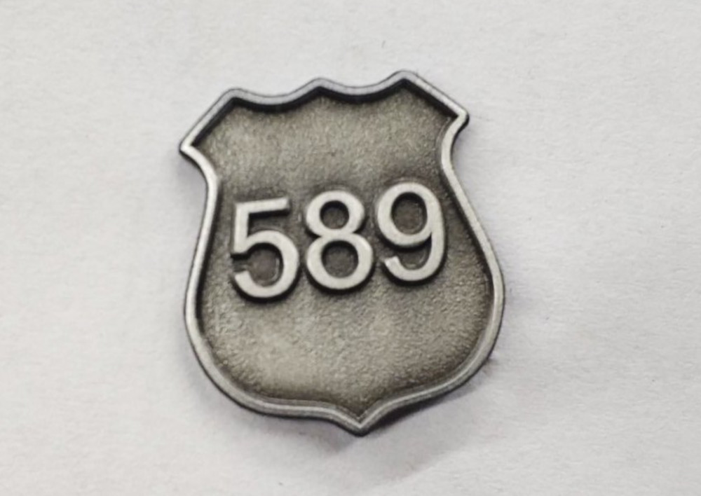 The commemorative pin Waterloo officers will be wearing throughout the month of August to honour David Nicholson.