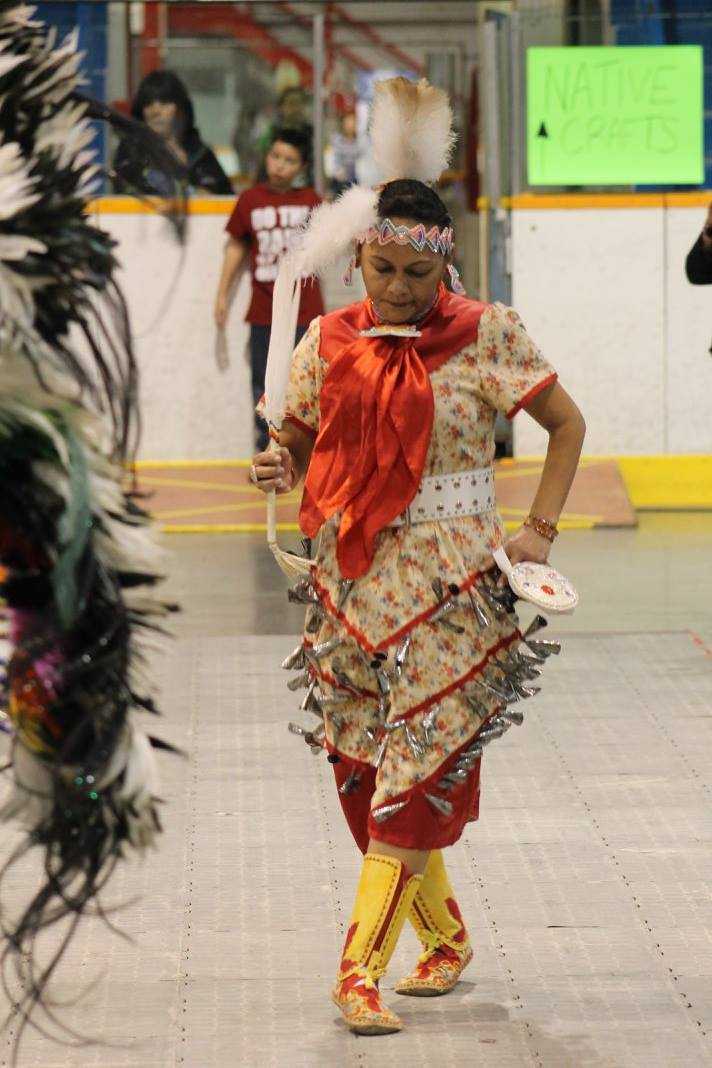 Bimadoshka Pucan dancing in a Jingle dress with one of the eagles feather attached to it