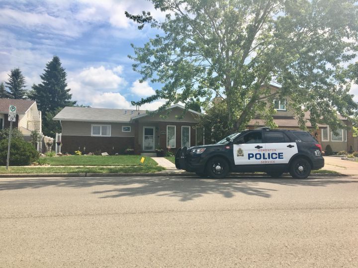 A police cruiser remained in the Blue Quill neighbourhood Friday, July 13, 2018, one day after two people were found dead inside an area home.