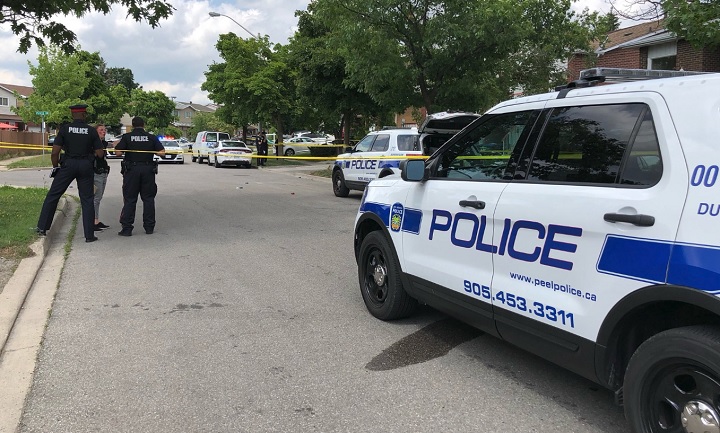 Police investigate the scene of a double shooting in Brampton on July 2, 2018.