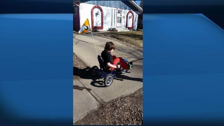 Caleb Cenek rides his trike in this photo from two years ago.