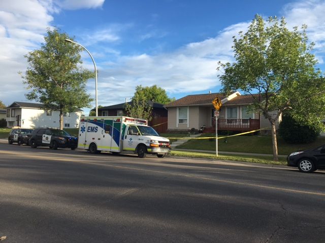 Calgary police investigate a reported break and entered that resulted in one person being sent to hospital in critical condition, Monday, July 2, 2018. 