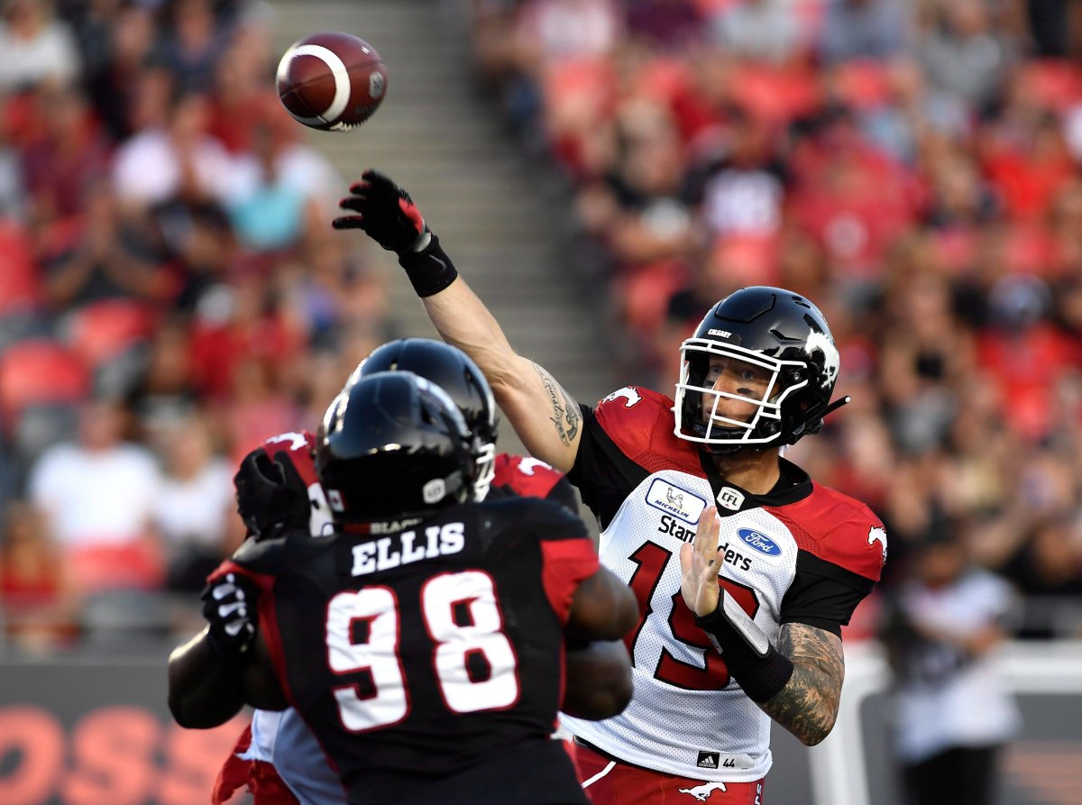 Calgary Stampeders quarterback Bo Levi Mitchell (19) throws the ball against the Ottawa Redblacks during first half CFL action in Ottawa on Thursday, July 12, 2018.