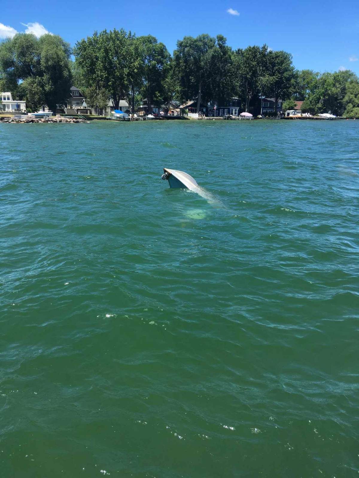 Police say a 52-year-old man was rescued from Cook's Bay in Innisfil after his boat capsized. 