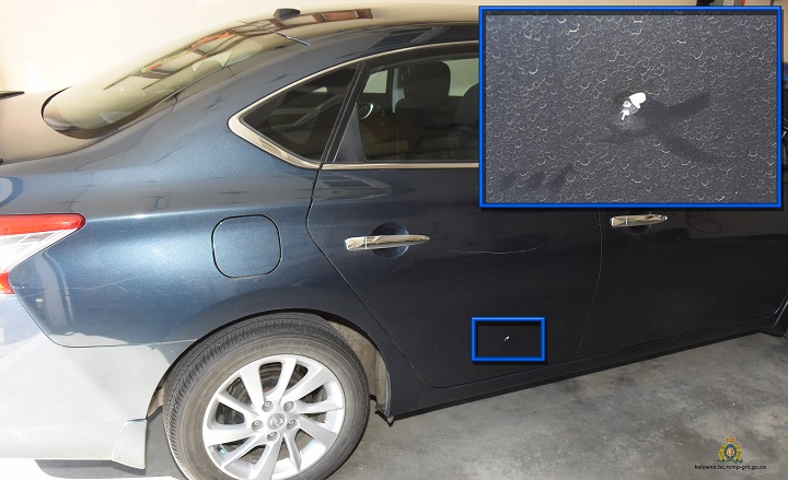 This image taken by investigators shows the damage caused to the passenger rear door of the woman’s blue Nissan Sentra.