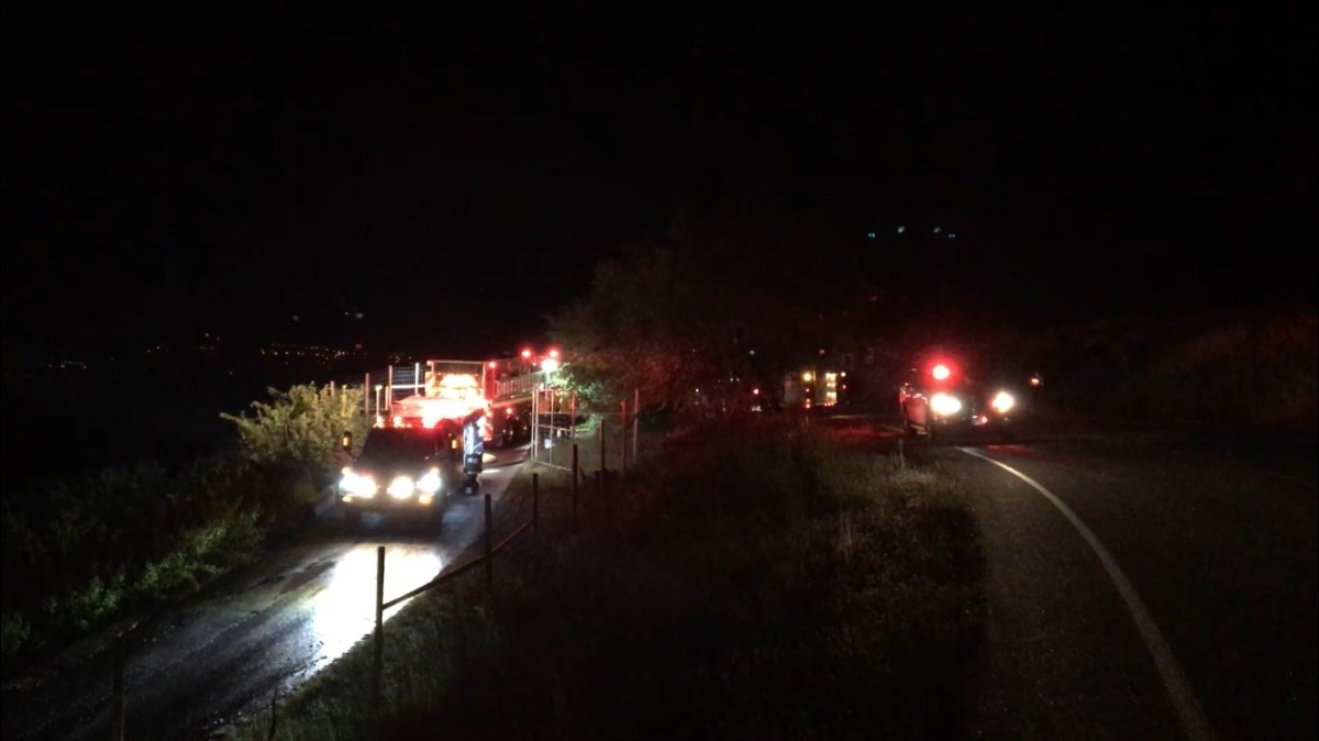 Fire trucks assembled on the steep driveway above a property in West Kelowna's Casa Loma neighbourhood Thursday night.