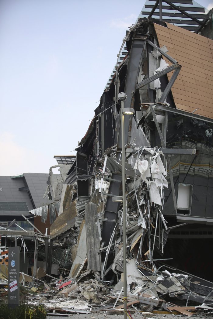 The Artz Pedregal shopping mall stands partially collapsed on the south side of Mexico City, Thursday, July 12, 2018.