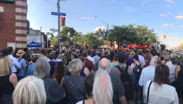 Hundreds of residents attend a vigil for the victims of the Danforth shooting.
