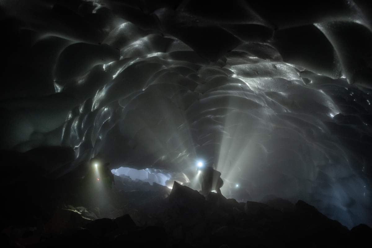 Cavers move through the Mothra Cave, West Crater Glacier, Mount St. Helens in June 2018.