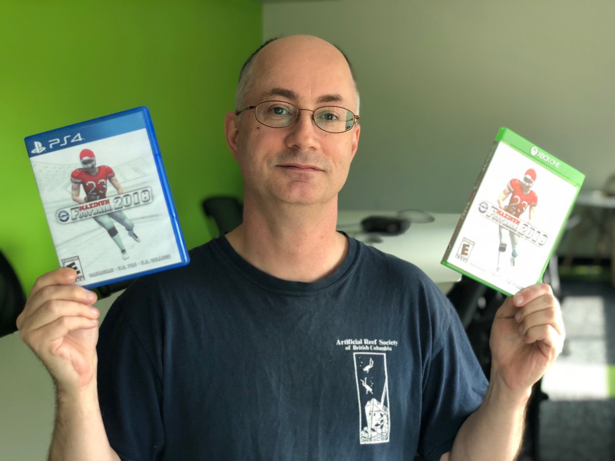 David Winter with the PS4 and XBox One verisons of his game "Maximum Football 2018.".