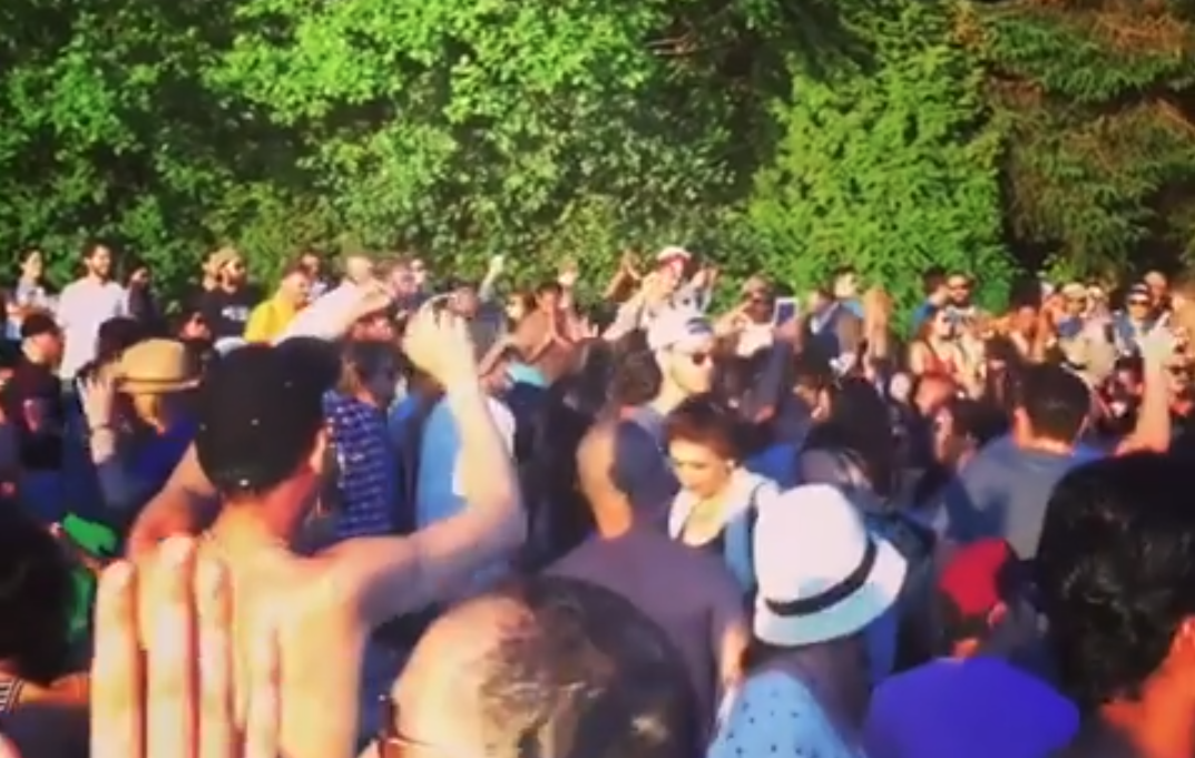 A screen capture of happy dancers at the Third Beach Drum Circle in June. 