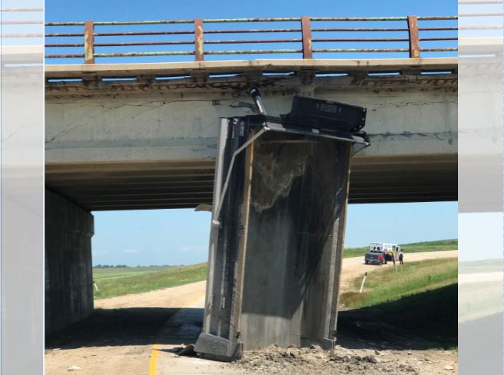 One lane of Highway 59  was closed to traffic Thursday afternoon after a dump truck tried to clear the underpass with the bucket not fully lowered.