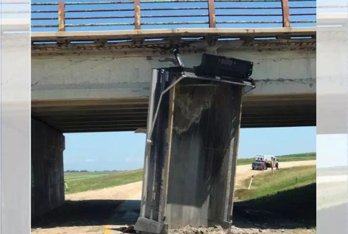 The province said Friday this bridge over the floodway along Highway 59 N was damaged after dump truck gets caught trying to pass underneath. 