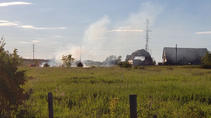 Crews were called to a grass fire near Edmonton's northwestern outskirts on July 4, 2018.
