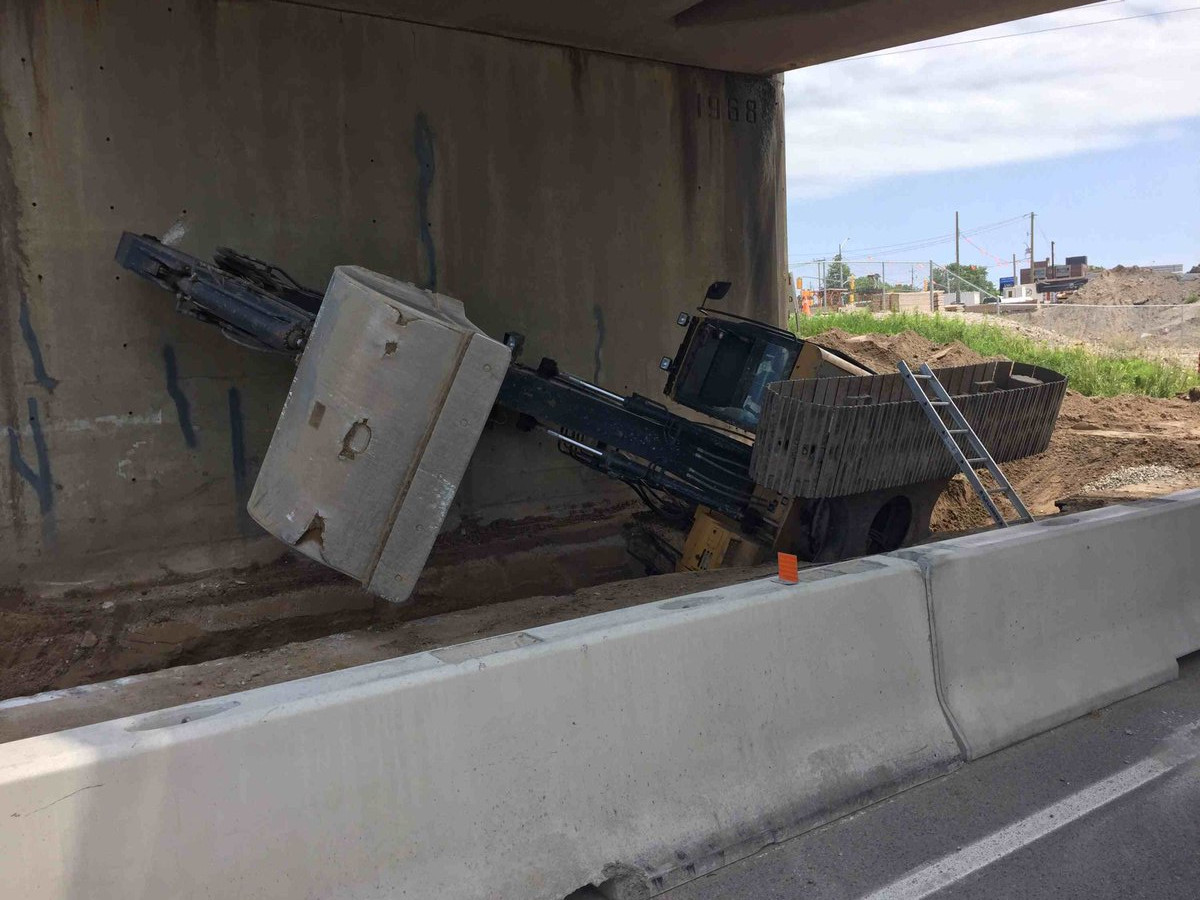 The Kitchener fire department was needed to free the man from the toppled excavator.