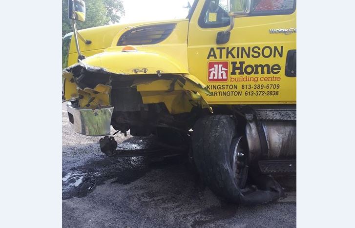 A collision between an SUV and a flat-bed truck closed Highway 38 on Monday.