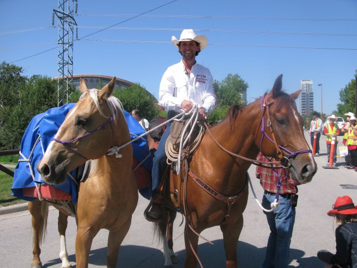 Filipe Masetti Leite rides out of the Stampede grounds in Calgary on July 8, 2012. Leite, who embarked on a two year journey from Calgary to Sao Paolo, Brazil, is now planning on riding his horse from Alaska to Calgary next year. 