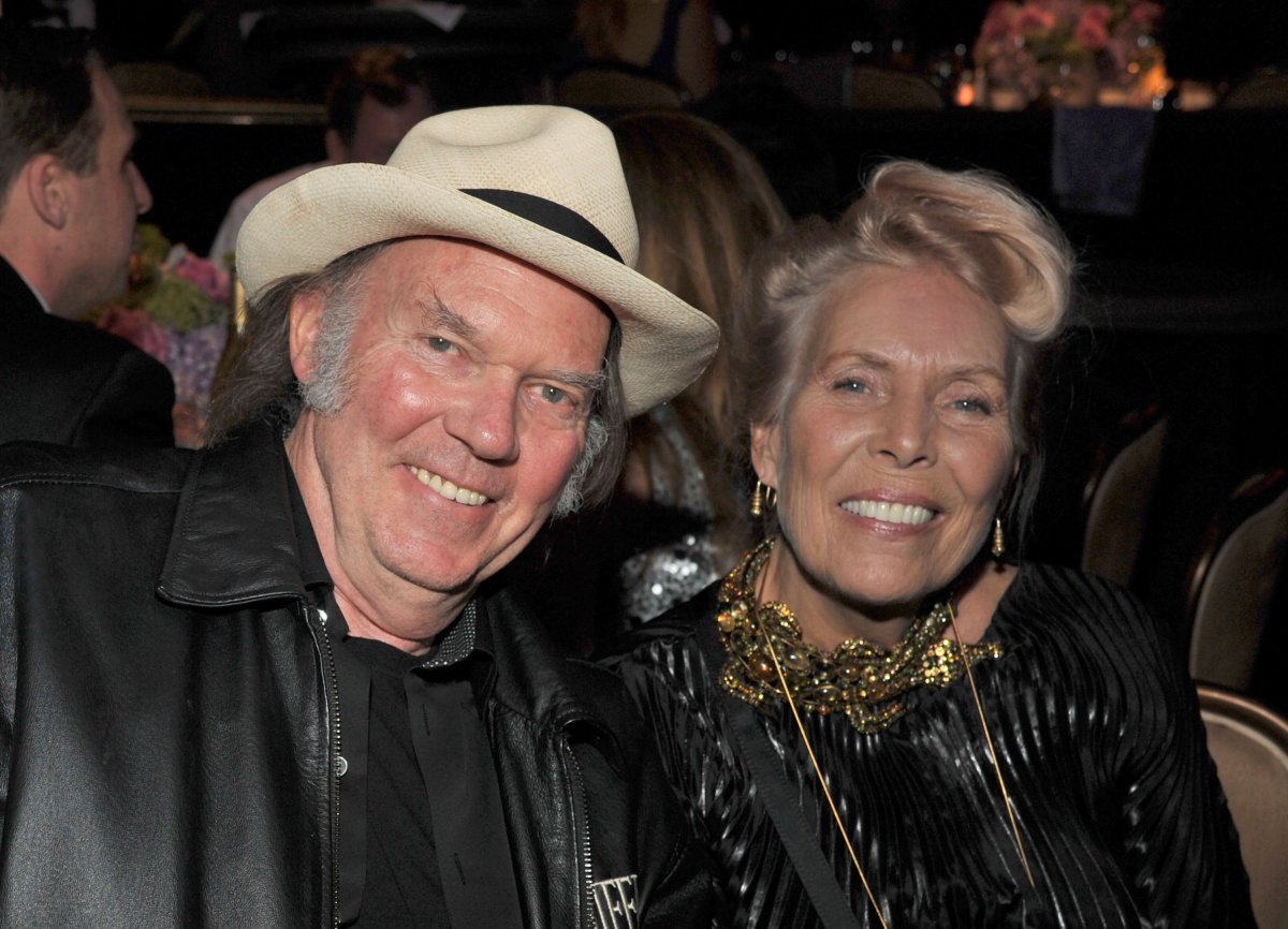 Singers Neil Young (L) and Joni Mitchell attend Clive Davis and The Recording Academy's 2012 Pre-GRAMMY Gala and Salute to Industry Icons Honoring Richard Branson at The Beverly Hilton hotel on February 11, 2012 in Beverly Hills, California.  (Photo by ).
