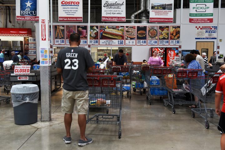 Customers stand in line at the check out aisles of a Costco Wholesale Corp. store in San Antonio, Texas, U.S., on Wednesday, May 30, 2018.