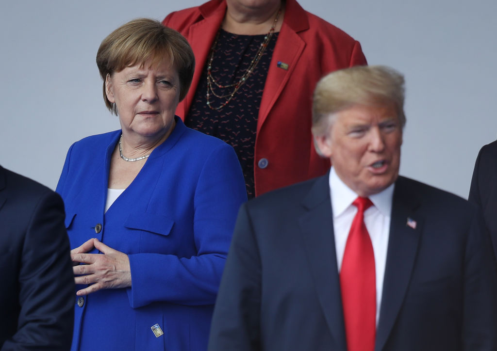 German Chancellor Angela Merkel and U.S. President Donald Trump attend the opening ceremony at the 2018 NATO Summit at NATO headquarters on July 11, 2018 in Brussels, Belgium. Leaders from NATO member and partner states are meeting for a two-day summit, which is being overshadowed by strong demands by U.S. President Trump for most NATO member countries to spend more on defense.