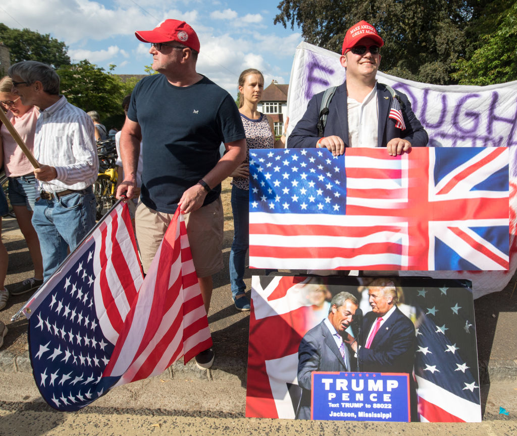 President Trump supporters join protesters gathering at the gates of Blenheim Palace where U.S. President Donald Trump is due to visit for dinner in Woodstock on July 12, in Oxfordshire, England.
