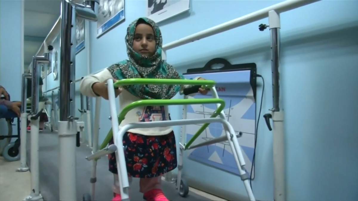 Eight-year-old Maya is taking her first steps in Istanbul on prosthetic limbs after photos of her struggling to move around a tent encampment in Idlib surfaced on social media. Maya suffers from a congenital disorder and was born without legs.