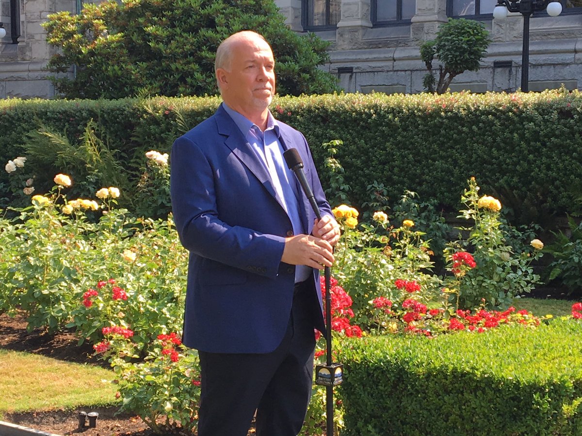 Premier John Horgan speaks to reporters on July 30, 2018 in Victoria. 