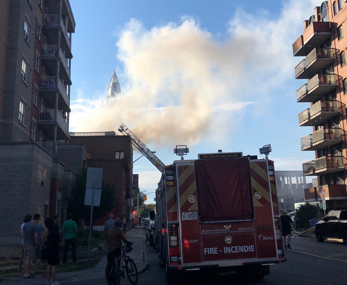 Ottawa firefighters extinguished a three-alarm fire that broke out on the rooftop deck of a three-storey building in the ByWard Market on Monday evening.