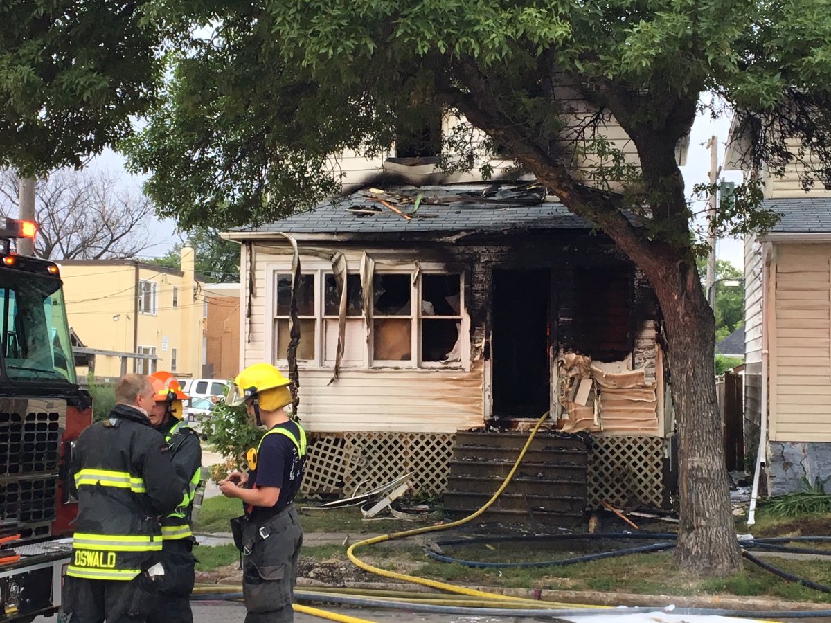 Five people were forced to jump to safety from a second floor window after a Friday morning house fire on Arlington.