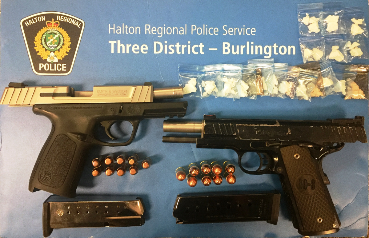 Halton police say they seized two guns and about 10 grams of crack cocaine during the arrest in Mississauga on Friday night.