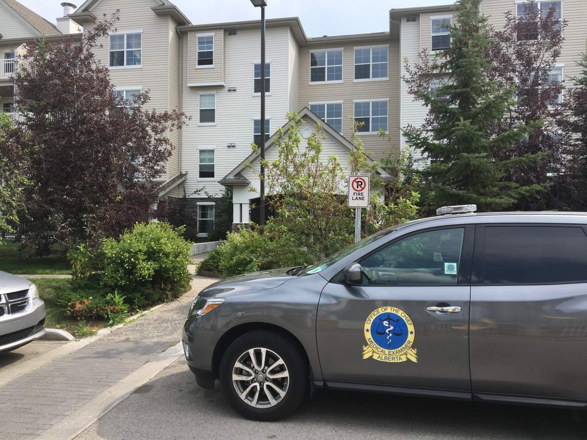 The medical examiner is seen at the scene where a person was found dead on Tuesday, July 31.