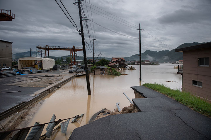 A washed out road pictured following heavy rains and flooding in Mihara on July 8, 2018.