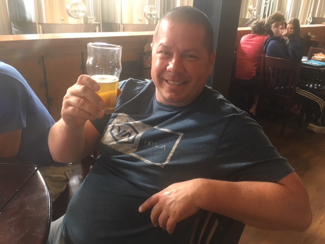 Josh Pitts from Vancouver, Washington, raises a glass on Independence Day in Astoria Oregon.