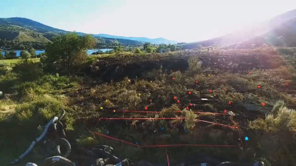 Kamloops fire investigation markers on private property along Shuswap Road, July 12, 2018