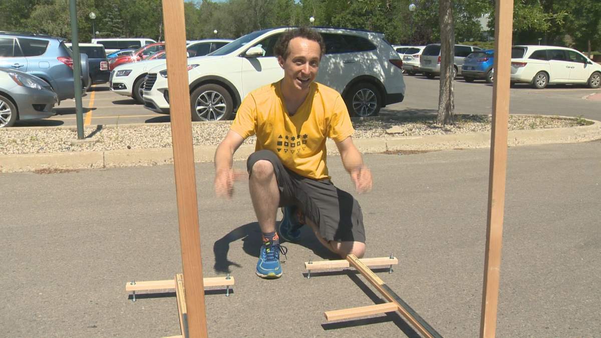 Kurtis Baute shows the sundials he used in his experiment to prove the Earth is round. 
