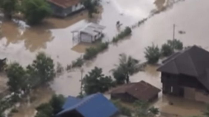 In the image made from aerial video taken Tuesday, July 24, 2018, villages are inundated with floodwaters from a collapsed dam in Attapeu province, southeastern Laos.