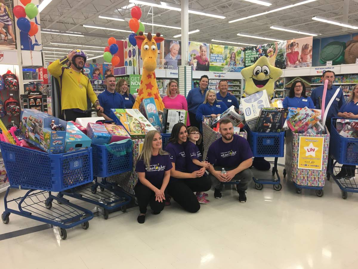 Five-year-old Lily posing with her eight shopping carts full of toys. She had three minutes to get as many free toys as she could, courtesy of Toys “R” Us and Starlight Children’s Foundation Canada.Wednesday, July 25, 2018.