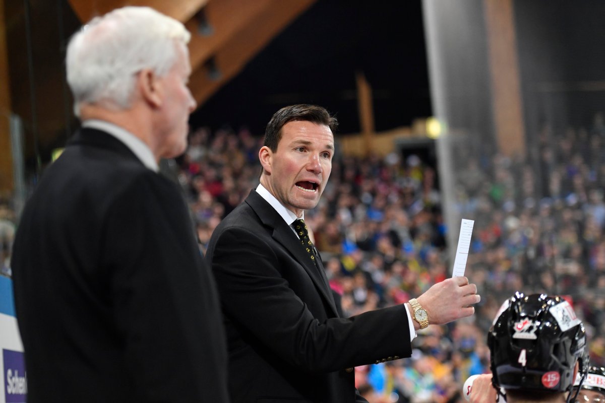 Team Canada's head coach Luke Richardson (R) and assistant coach Dave King during the game between Switzerlands HC Davos and Team Canada at the 90th Spengler Cup ice hockey tournament in Davos, Switzerland, 27 December 2016.